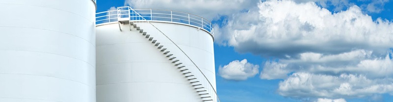 Petroleum oil tanks on blue sky